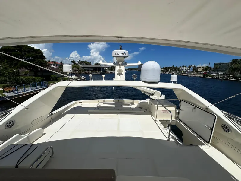 Slide: The Image of Flybridge view of 1998 Ferretti Yachts 80, featuring spacious deck and navigation equipment. - 15