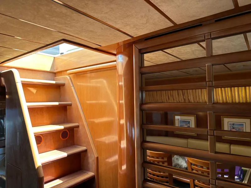 Slide: The Image of Luxurious interior of 1998 Ferretti Yachts 80, featuring wooden stairs and elegant design elements. - 18