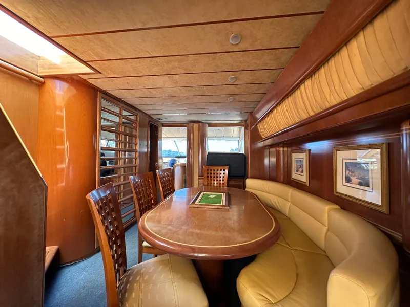 Slide: The Image of Luxurious interior of a 1998 Ferretti Yachts 80, featuring elegant wood and leather seating. - 19