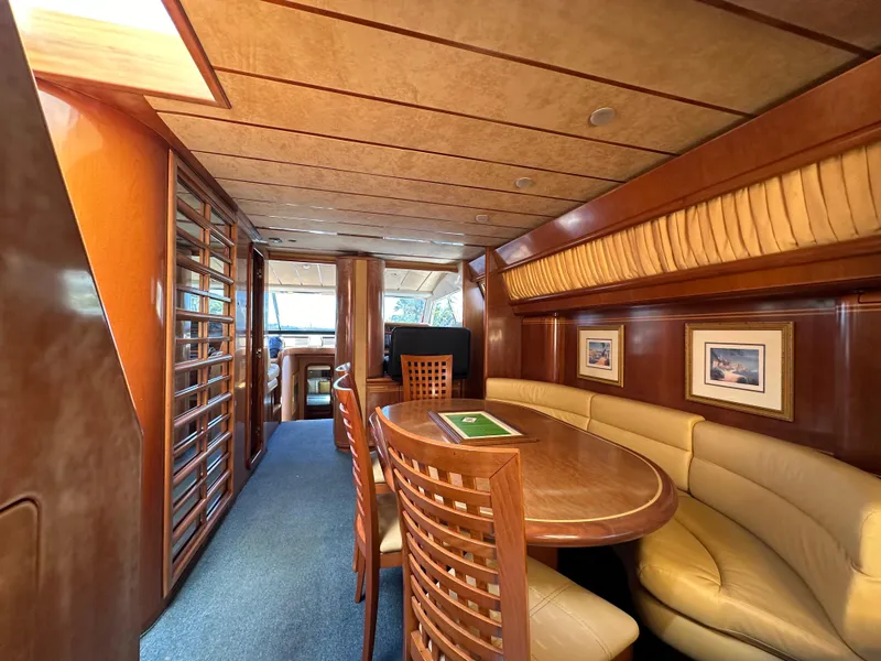 Slide: The Image of Luxurious interior of a 1998 Ferretti Yachts 80, featuring elegant wood and leather seating. - 20