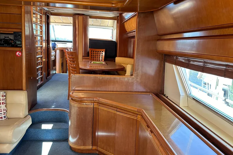 Slide: The Image of Luxurious interior of a 1998 Ferretti Yachts 80 with elegant wood finishes. - 23