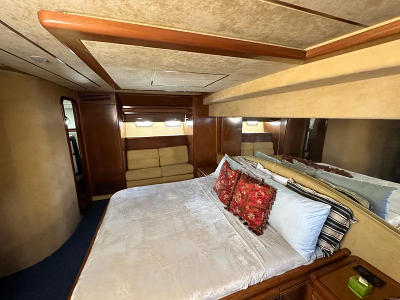 Slide: The Image of Luxurious bedroom interior of a 1998 Ferretti Yachts 80, featuring elegant wood finishes. - 29