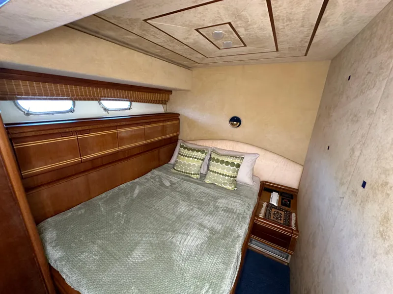 Slide: The Image of Luxurious bedroom interior of 1998 Ferretti Yachts 80 with elegant wood finish. - 31