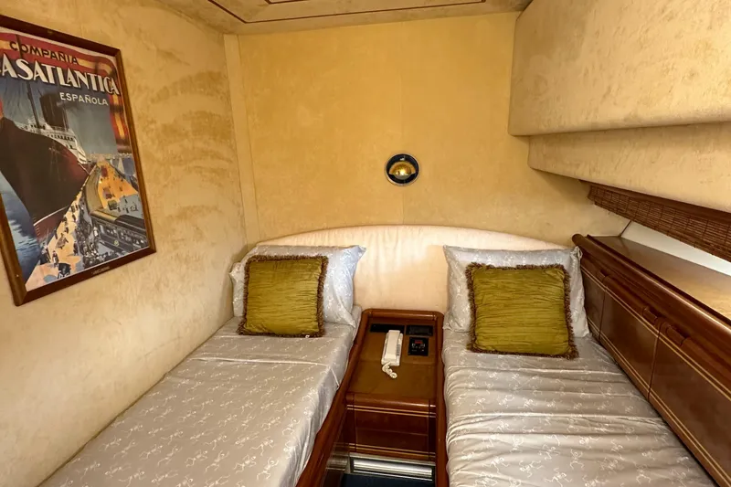 Slide: The Image of Luxurious twin cabin in 1998 Ferretti Yachts 80, featuring elegant decor and vintage artwork. - 33