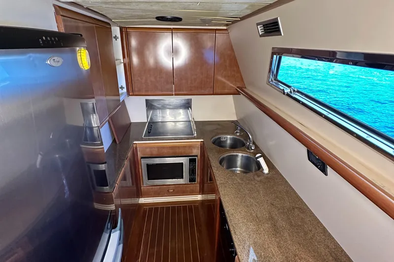 Slide: The Image of Galley kitchen in 1998 Ferretti Yachts 80 with ocean view, featuring modern appliances. - 34