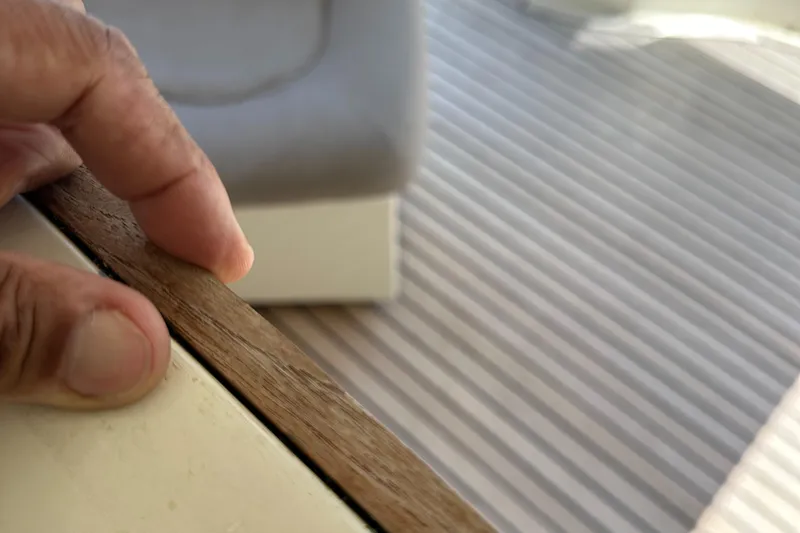 Slide: The Image of Close-up of hand touching wooden edge on 1998 Ferretti Yachts 80 interior. - 37