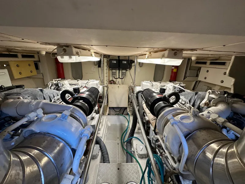 Slide: The Image of Engine room of a 1998 Ferretti Yachts 80, showcasing dual engines and mechanical components. - 41