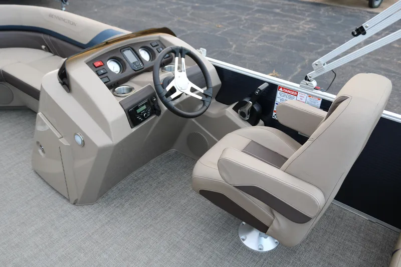 Slide: The Image of 2025 Bennington 20 SSRCX boat interior with steering console and captain's chair. - 14
