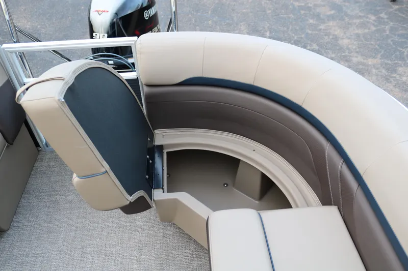 Slide: The Image of 2025 Bennington 20 SSRCX pontoon boat with open storage compartment and Yamaha motor. - 24
