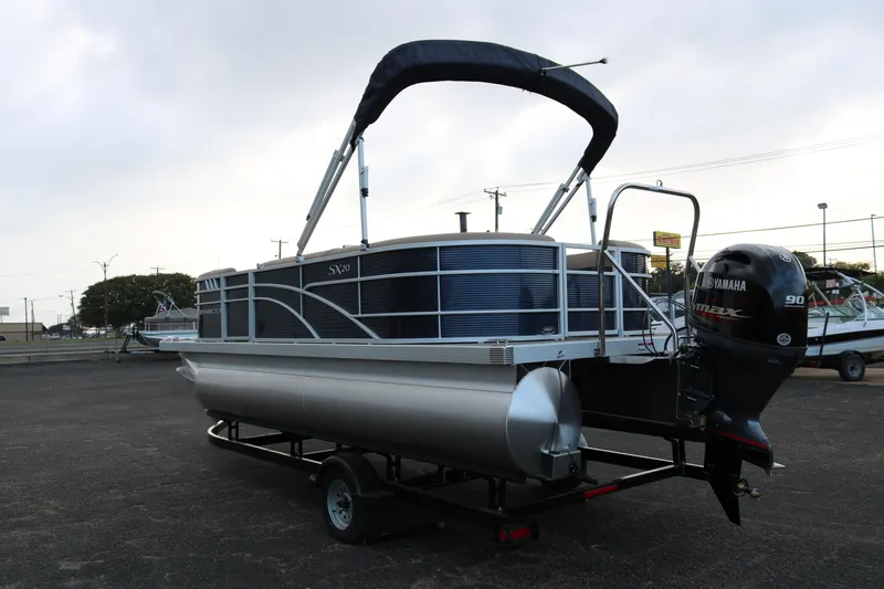 Slide: The Image of 2025 Bennington 20 SSRCX pontoon boat with Yamaha outboard motor on trailer. - 5
