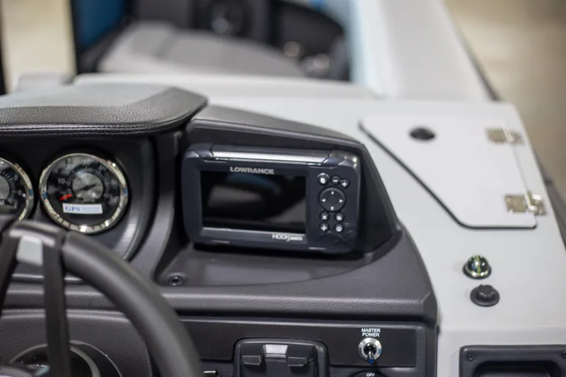 Slide: The Image of Dashboard of 2025 Trifecta 24E CS3 boat with Lowrance display and gauges. - 11