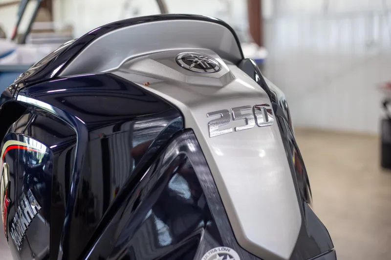 Slide: The Image of Close-up of a 2025 Trifecta 24E CS3 boat engine, featuring a 250 horsepower design. - 4