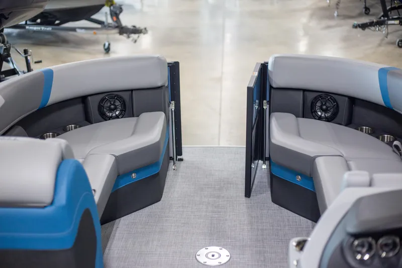 Slide: The Image of Interior of 2025 Trifecta 24E CS3 boat with gray and blue seating. - 6
