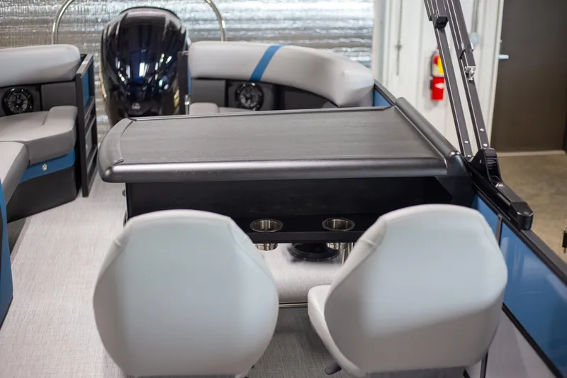 Slide: The Image of Interior of 2025 Trifecta 24E CS3 boat with seating and table. - 7