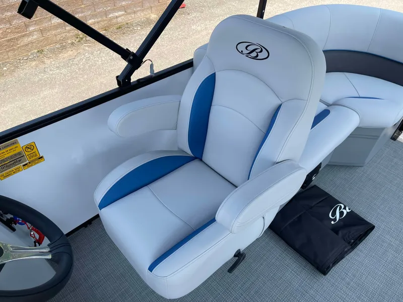Slide: The Image of 2025 Bentley Pontoons Bolt 223 interior with plush white and blue seating. - 12