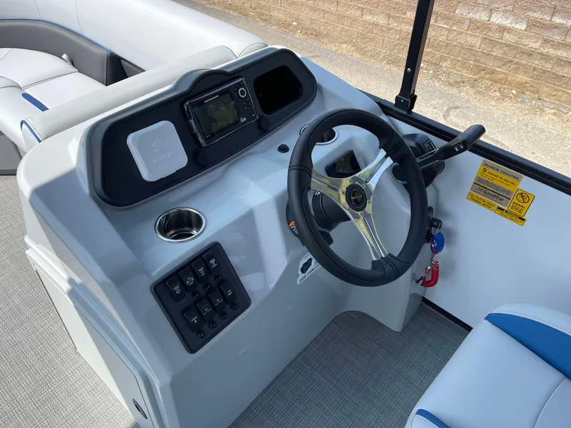 Slide: The Image of 2025 Bentley Pontoons Bolt 223 dashboard with steering wheel and controls. - 13