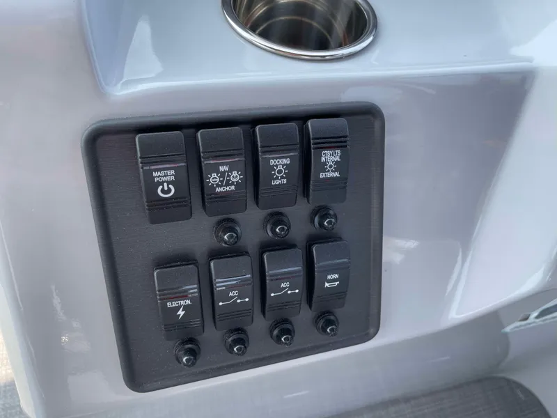 Slide: The Image of Control panel of 2025 Bentley Pontoons Bolt 223 with labeled switches. - 15