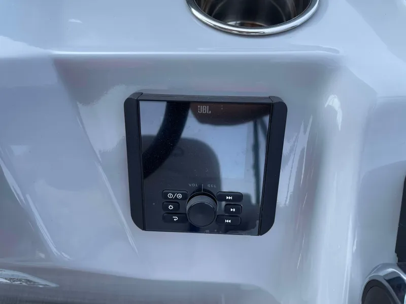 Slide: The Image of 2025 Bentley Pontoons Bolt 223 dashboard with JBL audio control panel. - 16
