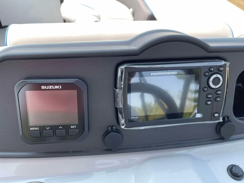 Slide: The Image of 2025 Bentley Pontoons Bolt 223 dashboard with Suzuki and Humminbird displays. - 17
