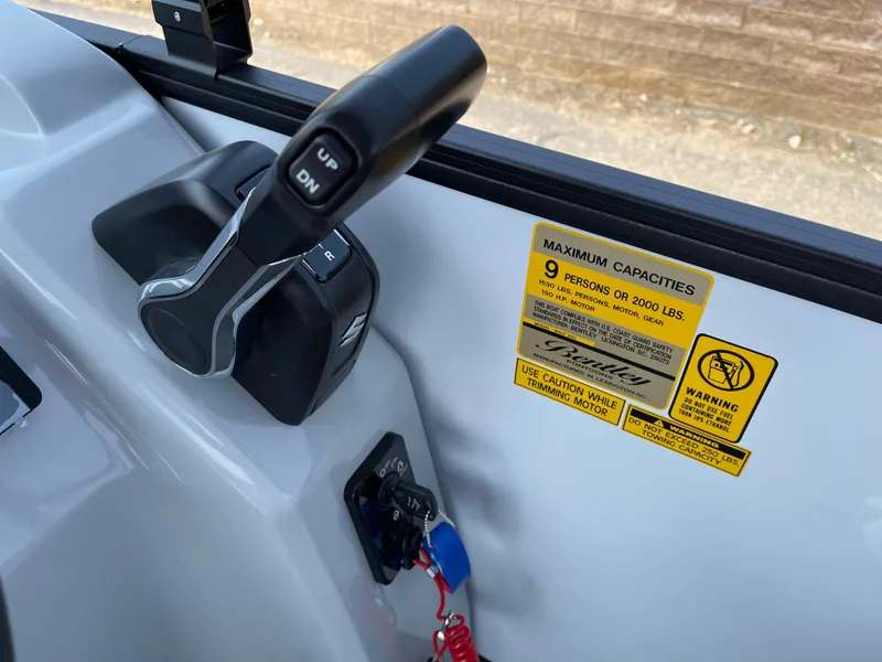 Slide: The Image of Bentley Pontoons Bolt 223 control panel with capacity warning label, 2025 model. - 18