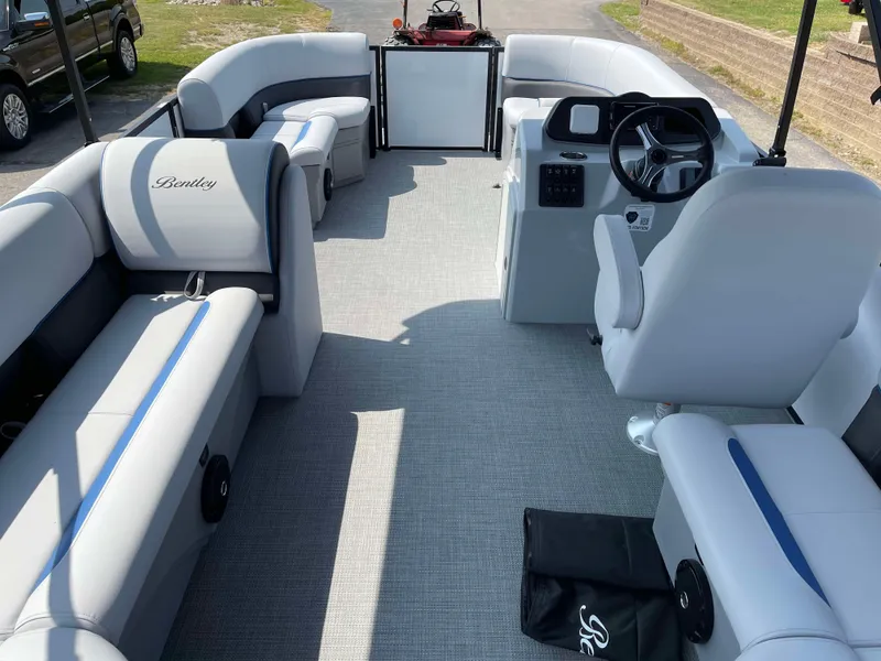 Slide: The Image of 2025 Bentley Pontoons Bolt 223 interior with spacious seating and modern helm. - 21