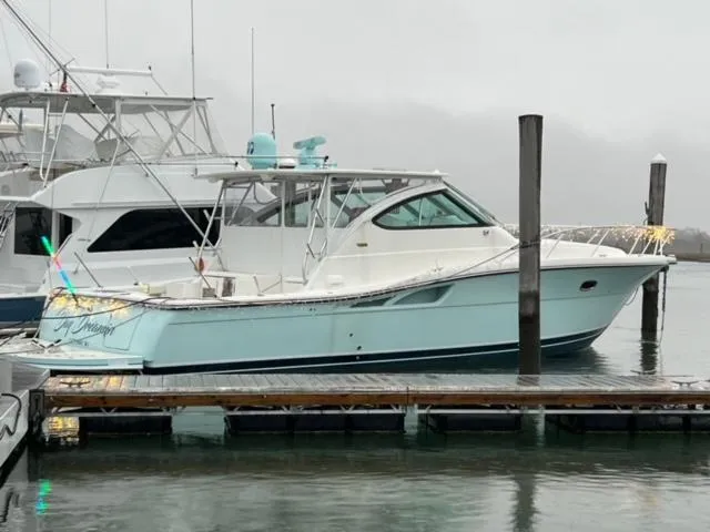 Slide: The Image of 2005 Tiara Yachts 4200 Open docked in a marina on a foggy day. - 1