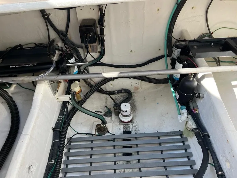 Slide: The Image of Engine compartment of a 2005 Tiara Yachts 4200 Open, showcasing wiring and components. - 21