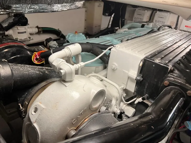 Slide: The Image of Engine compartment of 2005 Tiara Yachts 4200 Open, showcasing detailed machinery. - 24