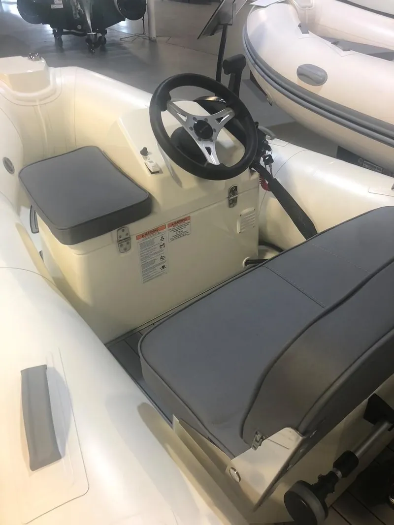 Slide: The Image of 2005 Tiara Yachts 4200 Open interior with steering wheel and seating. - 32