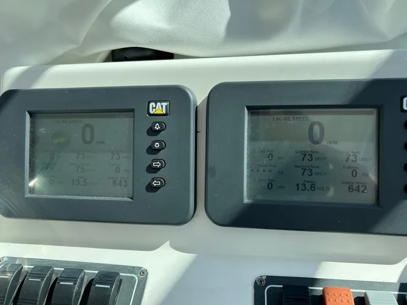 Slide: The Image of Dashboard of a 2005 Tiara Yachts 4200 Open with CAT engine displays. - 8