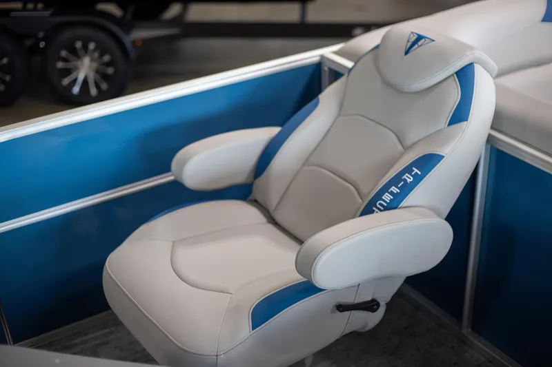 Slide: The Image of Luxurious Trifecta 24TRFC LE 2025 boat seat with blue accents and ergonomic design. - 4