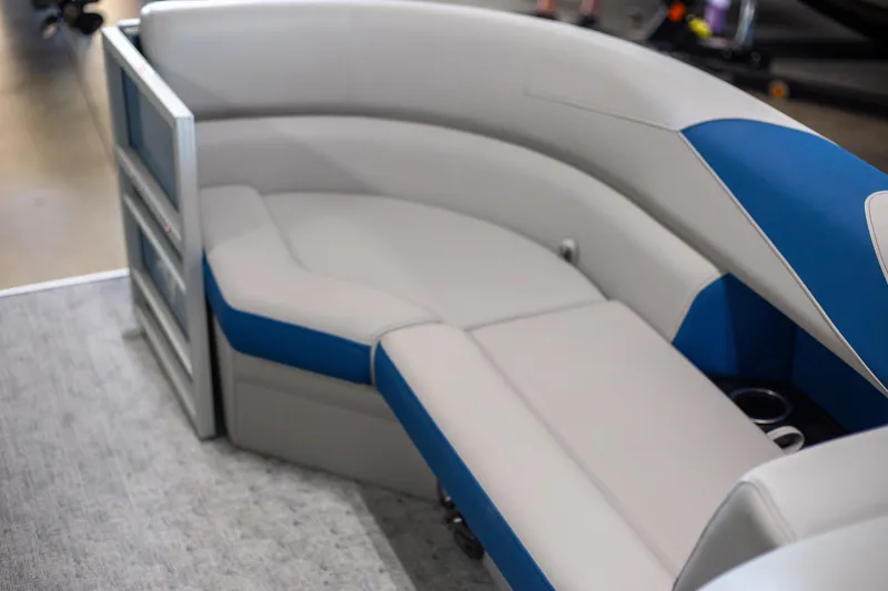 Slide: The Image of 2025 Trifecta 24TRFC LE boat interior with gray and blue seating. - 7