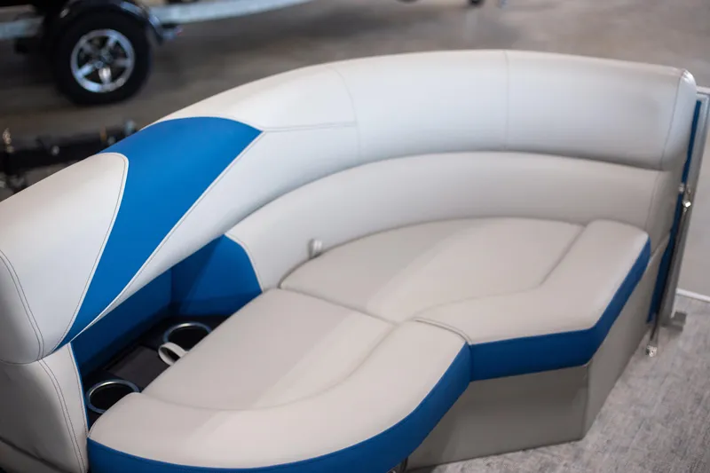 Slide: The Image of 2025 Trifecta 24TRFC LE boat seating with blue and white upholstery. - 8