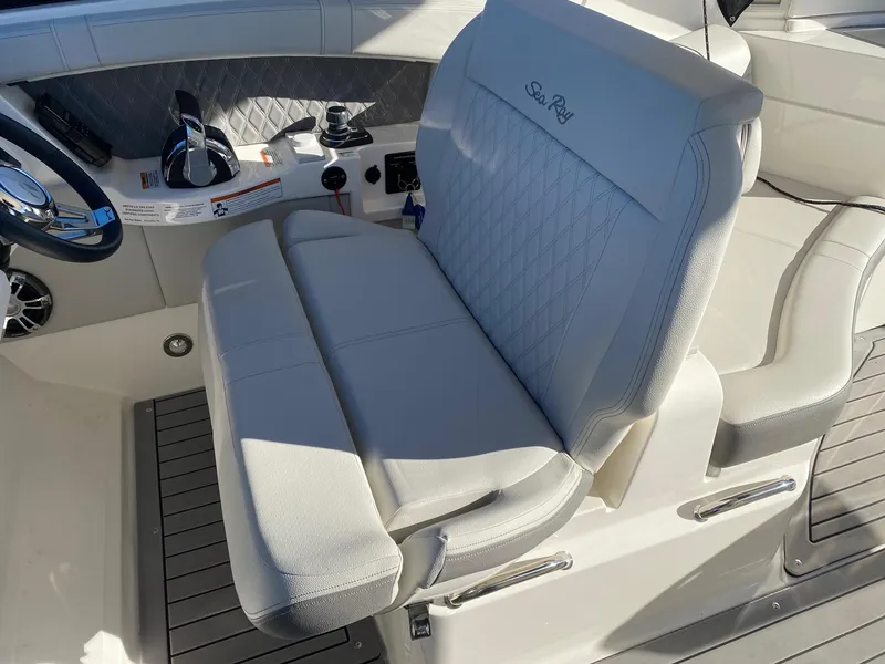 Slide: The Image of 2020 Sea Ray SLX 350 helm seat with luxurious white upholstery and modern design. - 10