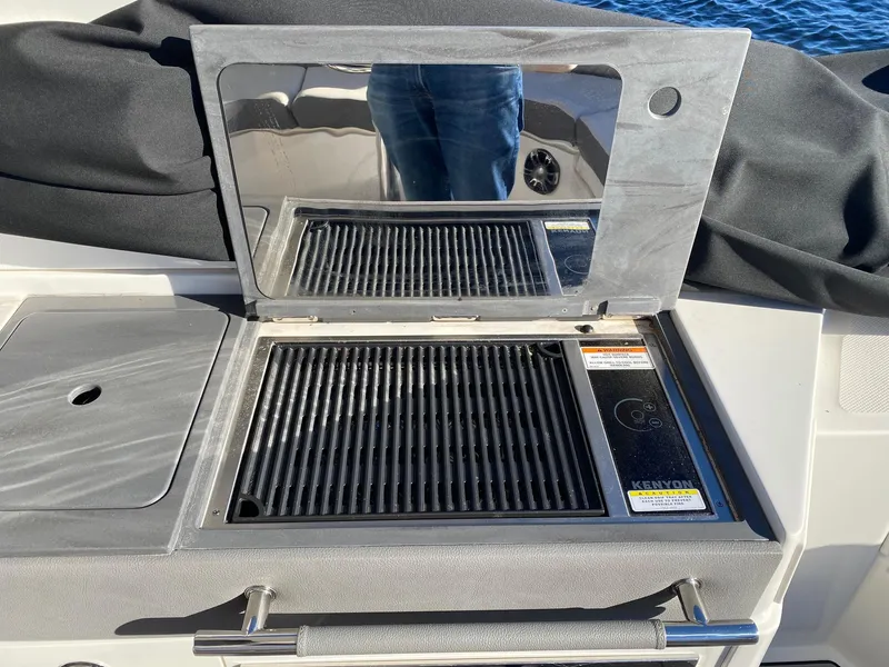 Slide: The Image of Outdoor grill on 2020 Sea Ray SLX 350 boat with stainless steel finish. - 17