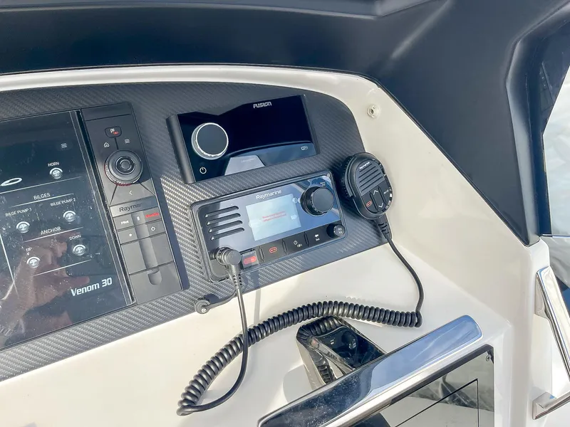 Slide: The Image of Control panel of 2025 Ribco Venom 30 boat with communication equipment. - 18