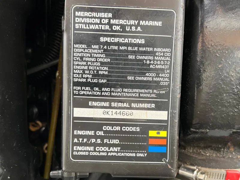 Slide: The Image of Engine specifications label for 1997 Sea Ray 330 Sundancer Cruiser, detailing MerCruiser engine information. - 23