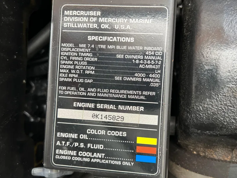 Slide: The Image of Engine specifications label on a 1997 Sea Ray 330 Sundancer Cruiser, featuring serial number and color codes. - 24