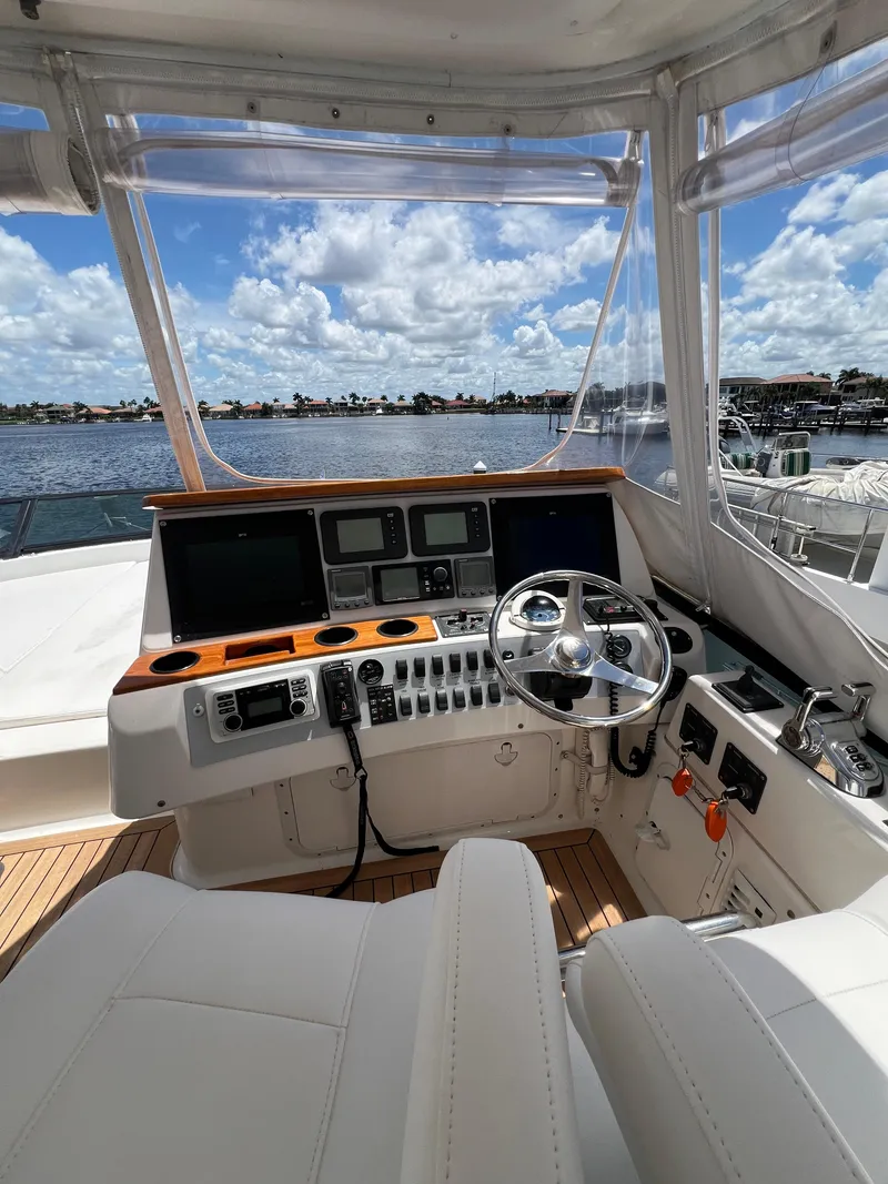 Slide: The Image of 2005 Neptunus 62 Flybridge yacht helm with panoramic water view. - 13