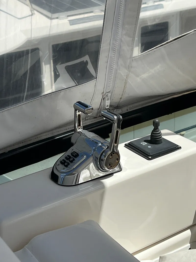 Slide: The Image of 2005 Neptunus 62 Flybridge yacht controls with joystick and throttle levers. - 18