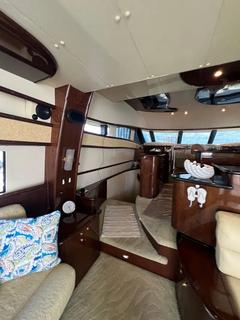 Slide: The Image of Luxurious interior of 2005 Neptunus 62 Flybridge yacht with elegant wood finishes. - 22
