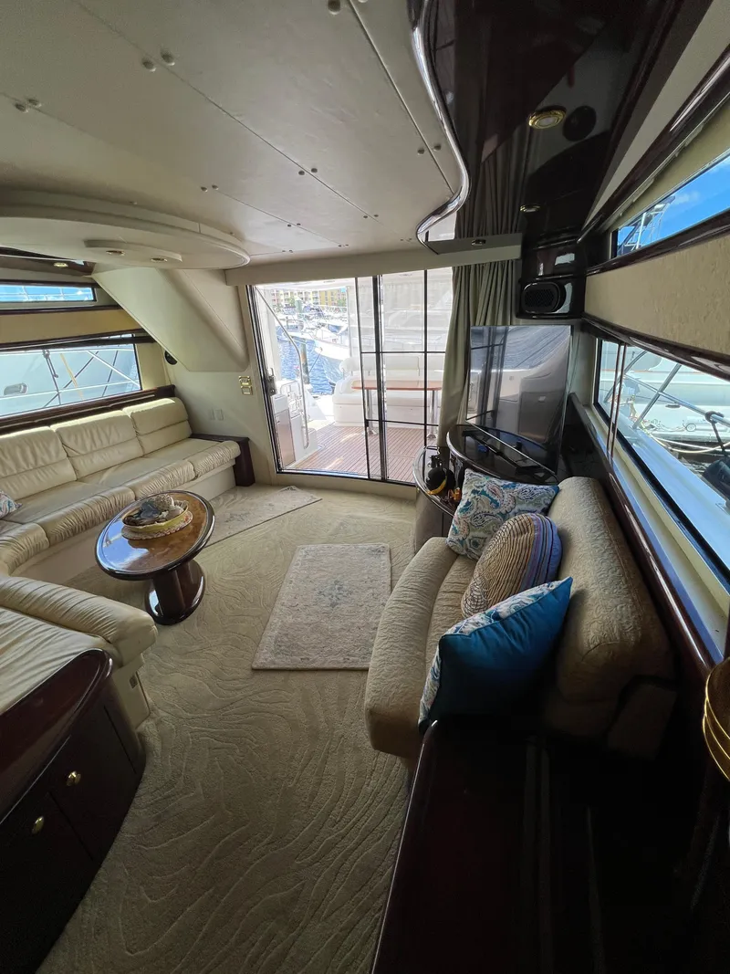 Slide: The Image of Luxurious 2005 Neptunus 62 Flybridge yacht interior with elegant seating and panoramic windows. - 24