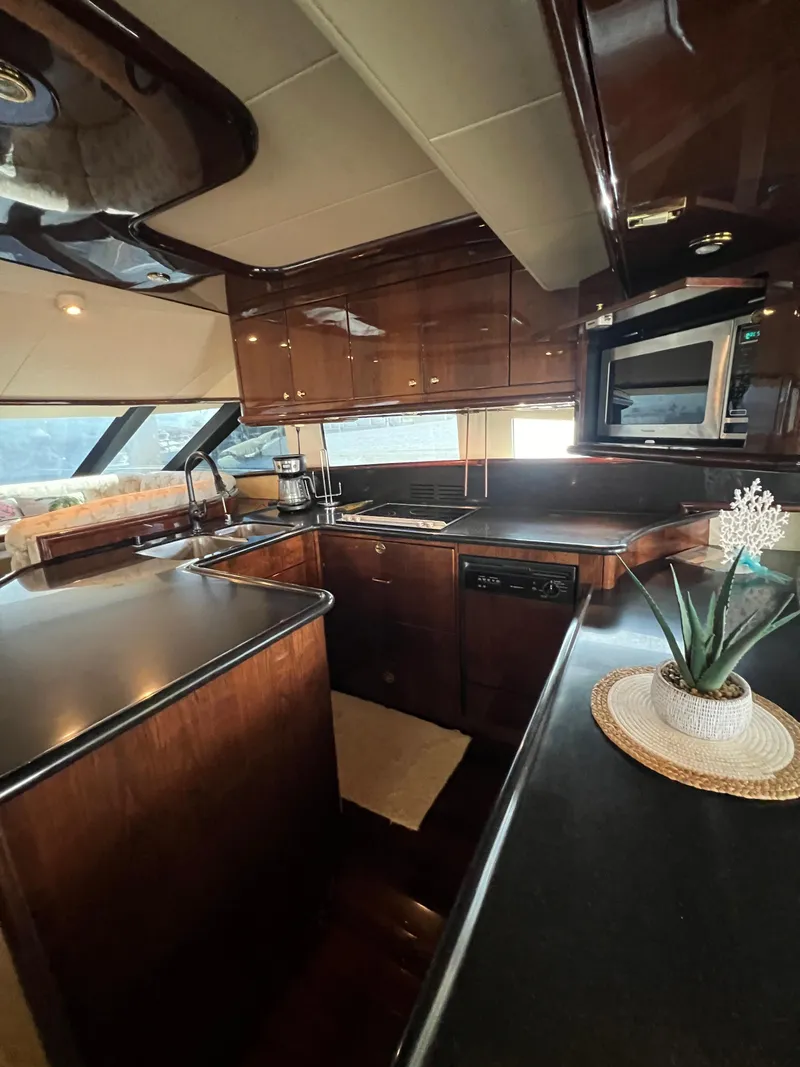 Slide: The Image of Luxurious kitchen interior of 2005 Neptunus 62 Flybridge yacht with modern amenities. - 25
