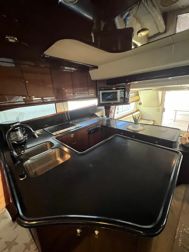 Slide: The Image of Luxurious kitchen interior of 2005 Neptunus 62 Flybridge yacht with modern amenities. - 26