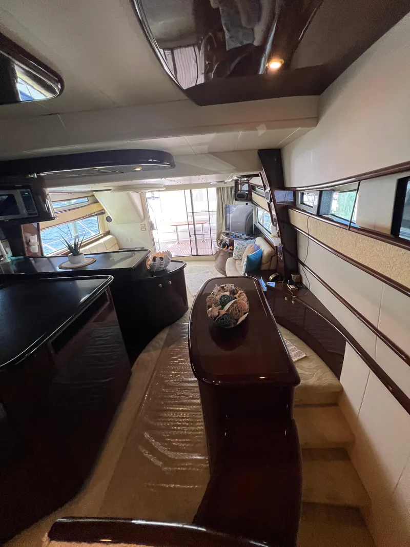 Slide: The Image of Luxurious 2005 Neptunus 62 Flybridge yacht interior with elegant seating and modern design. - 27