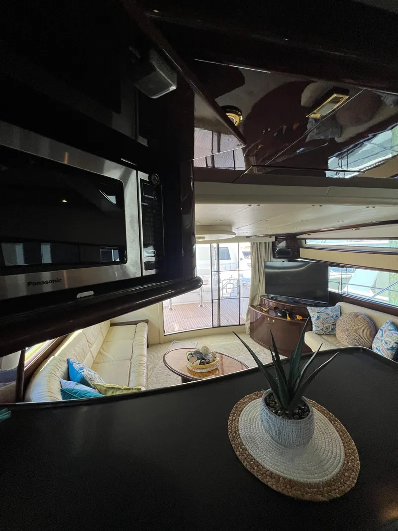 Slide: The Image of Interior of 2005 Neptunus 62 Flybridge yacht with modern decor and seating area. - 28