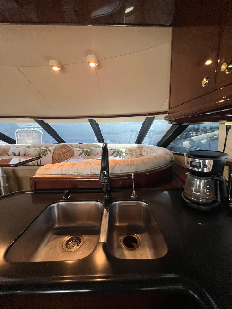 Slide: The Image of Luxurious 2005 Neptunus 62 Flybridge yacht interior with kitchen sink and coffee maker. - 29