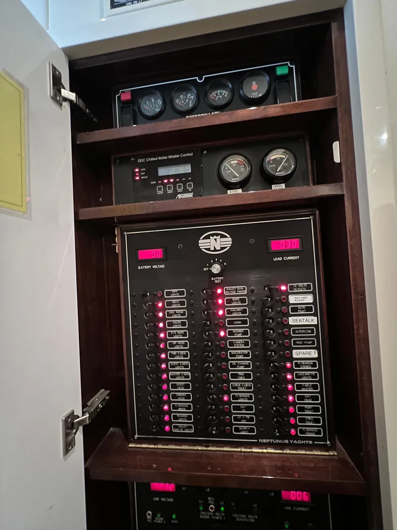 Slide: The Image of Electrical panel of 2005 Neptunus 62 Flybridge yacht with gauges and switches. - 33