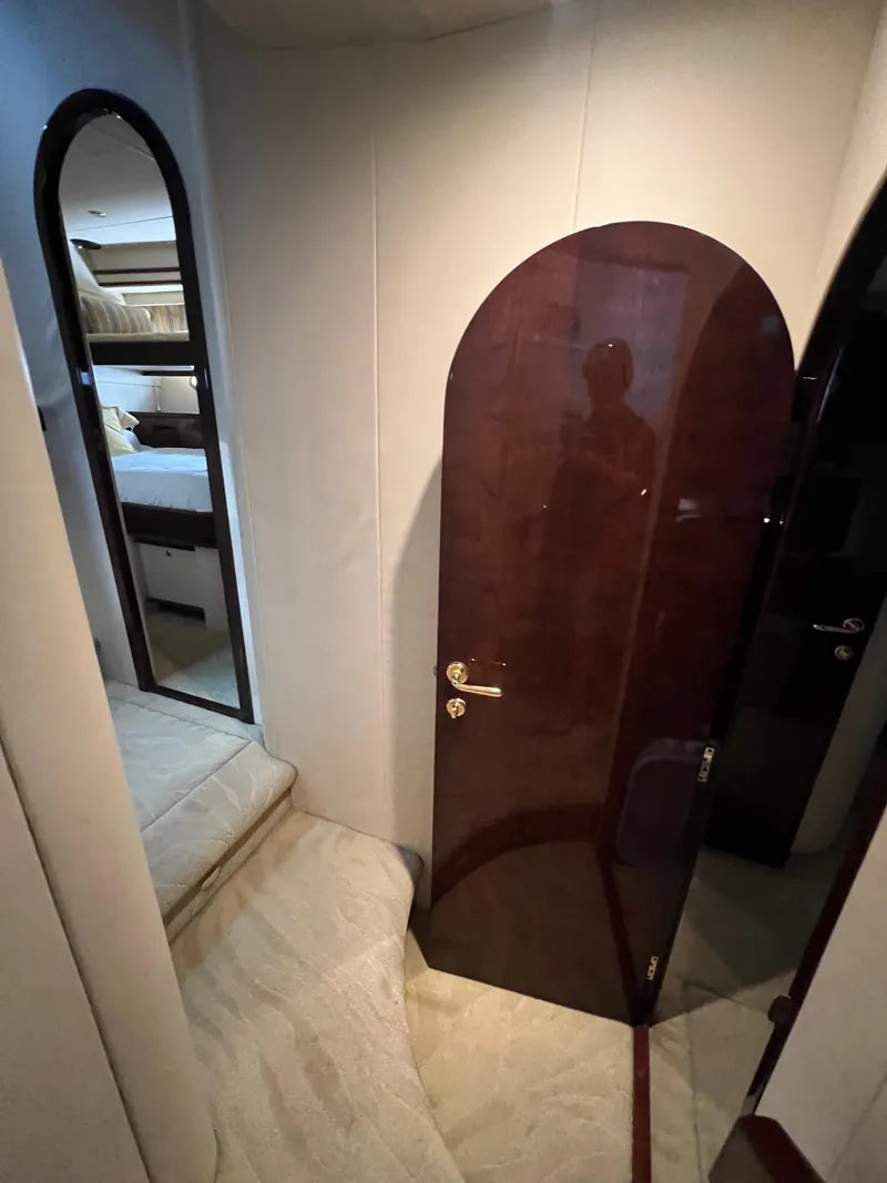 Slide: The Image of Interior of 2005 Neptunus 62 Flybridge yacht with elegant wood door and plush carpeting. - 35