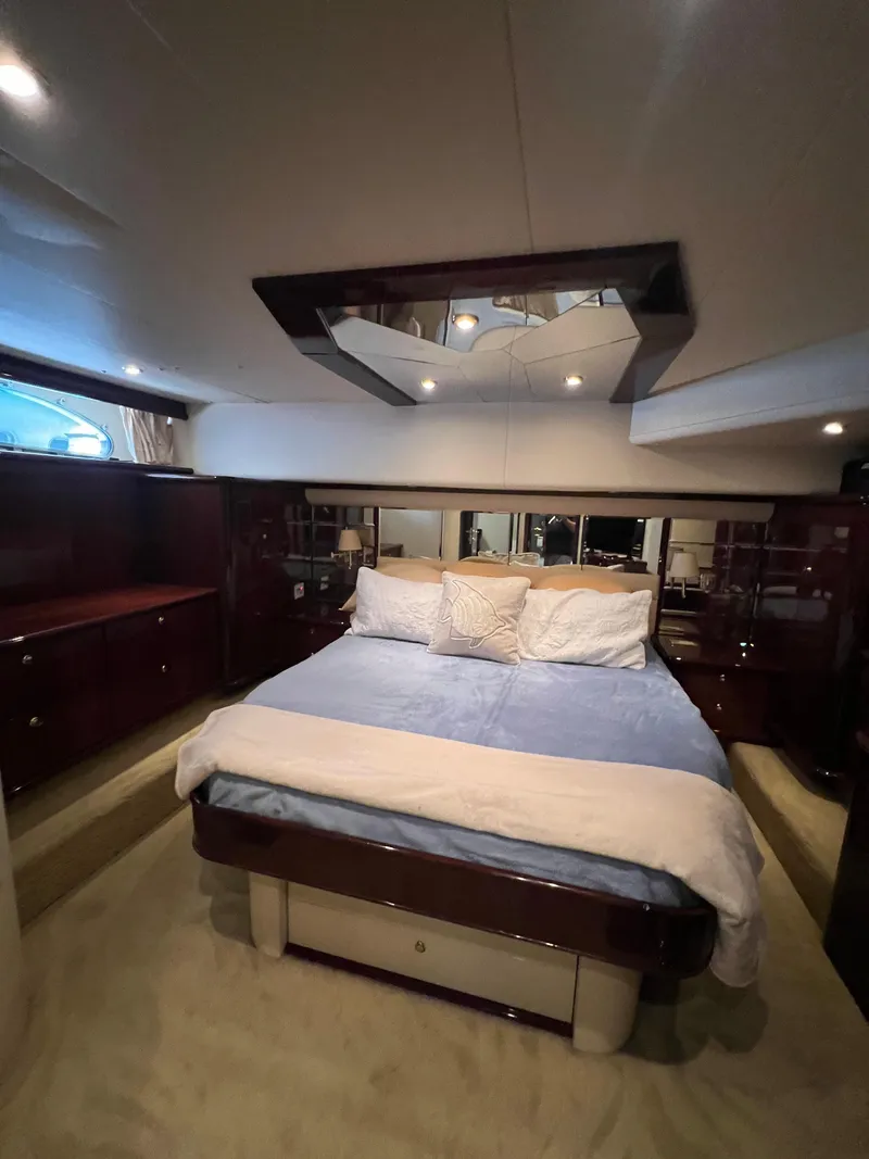 Slide: The Image of Luxurious bedroom interior of 2005 Neptunus 62 Flybridge yacht with elegant bedding. - 36